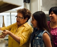 Three generations cooking together