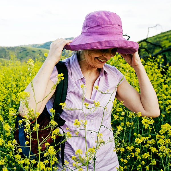 Caucasian woman standing in tall grass